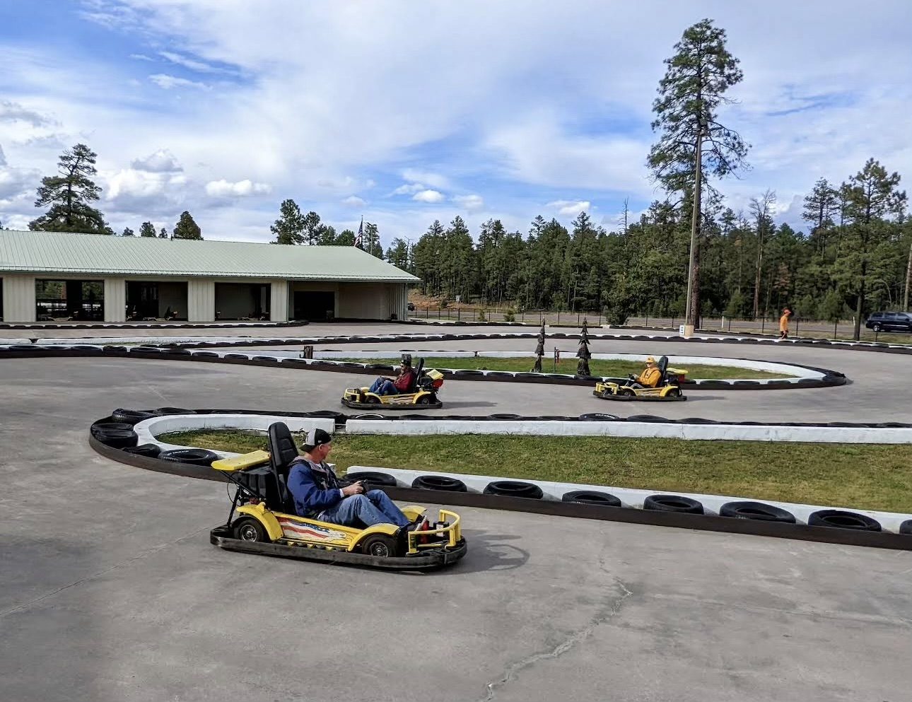 Go-karts racing on the track at White Mountain Family Fun Park in Lakeside, Arizona