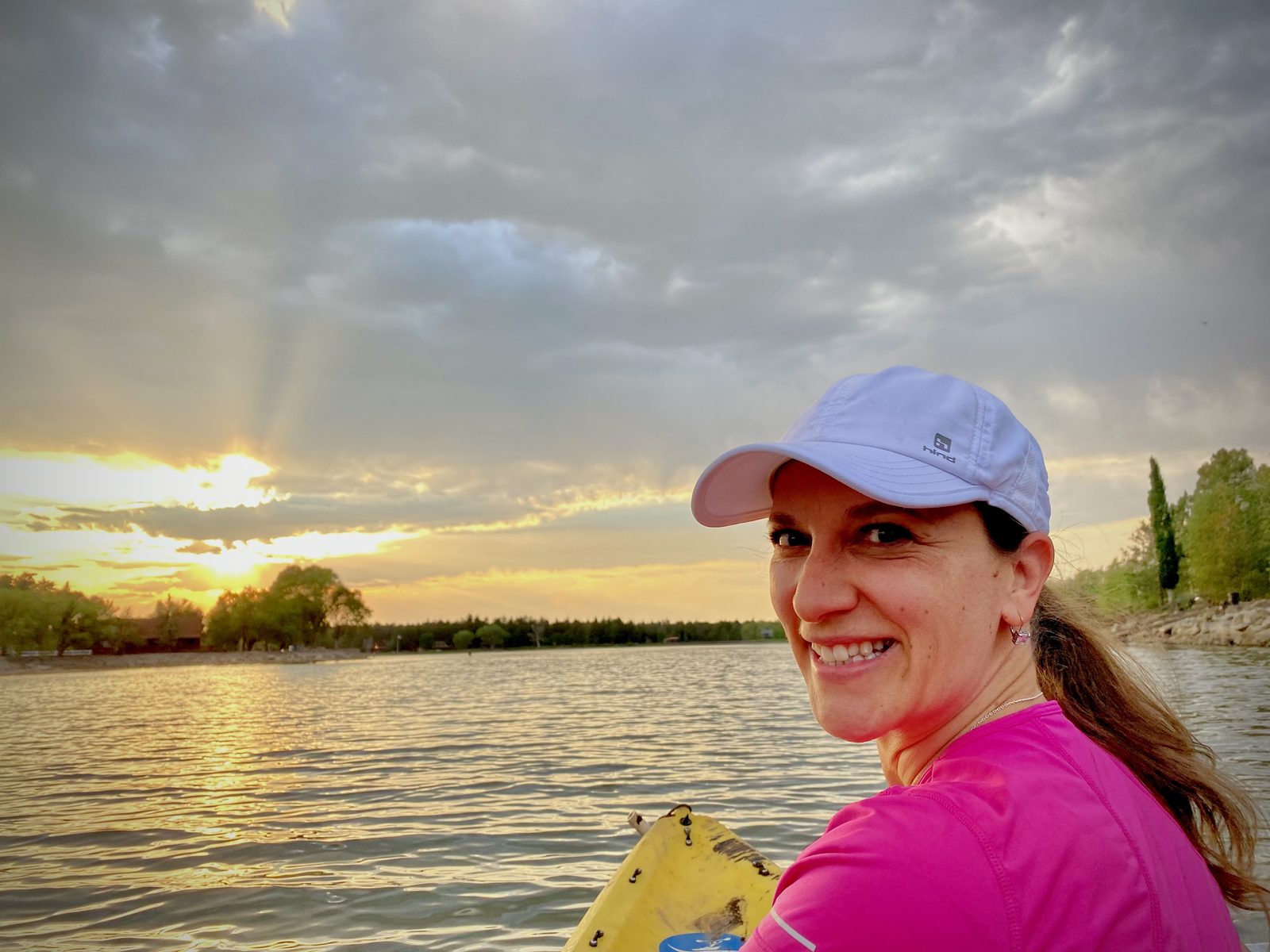 Kayaker on Rainbow Lake at sunrise near Lakeside, Arizona