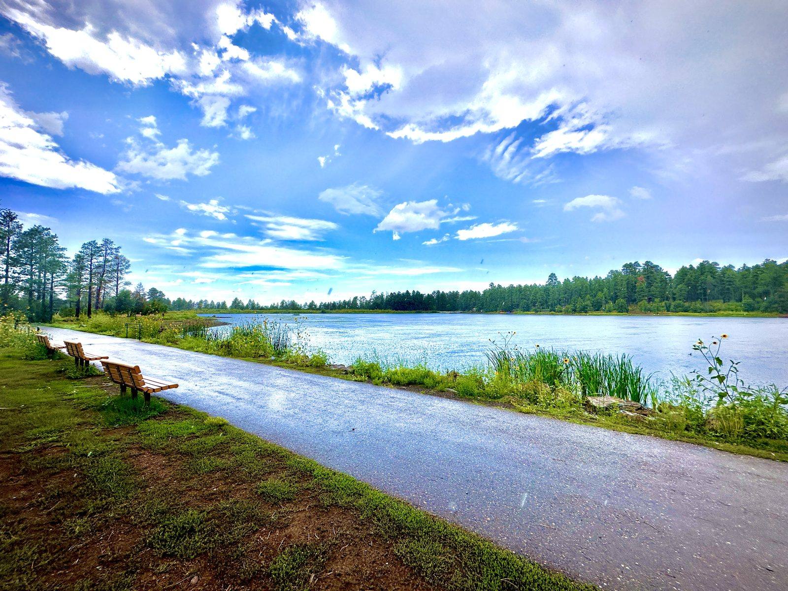 The paved walking loop along the water at Woodland Lake Park in Pinetop-Lakeside, Arizona