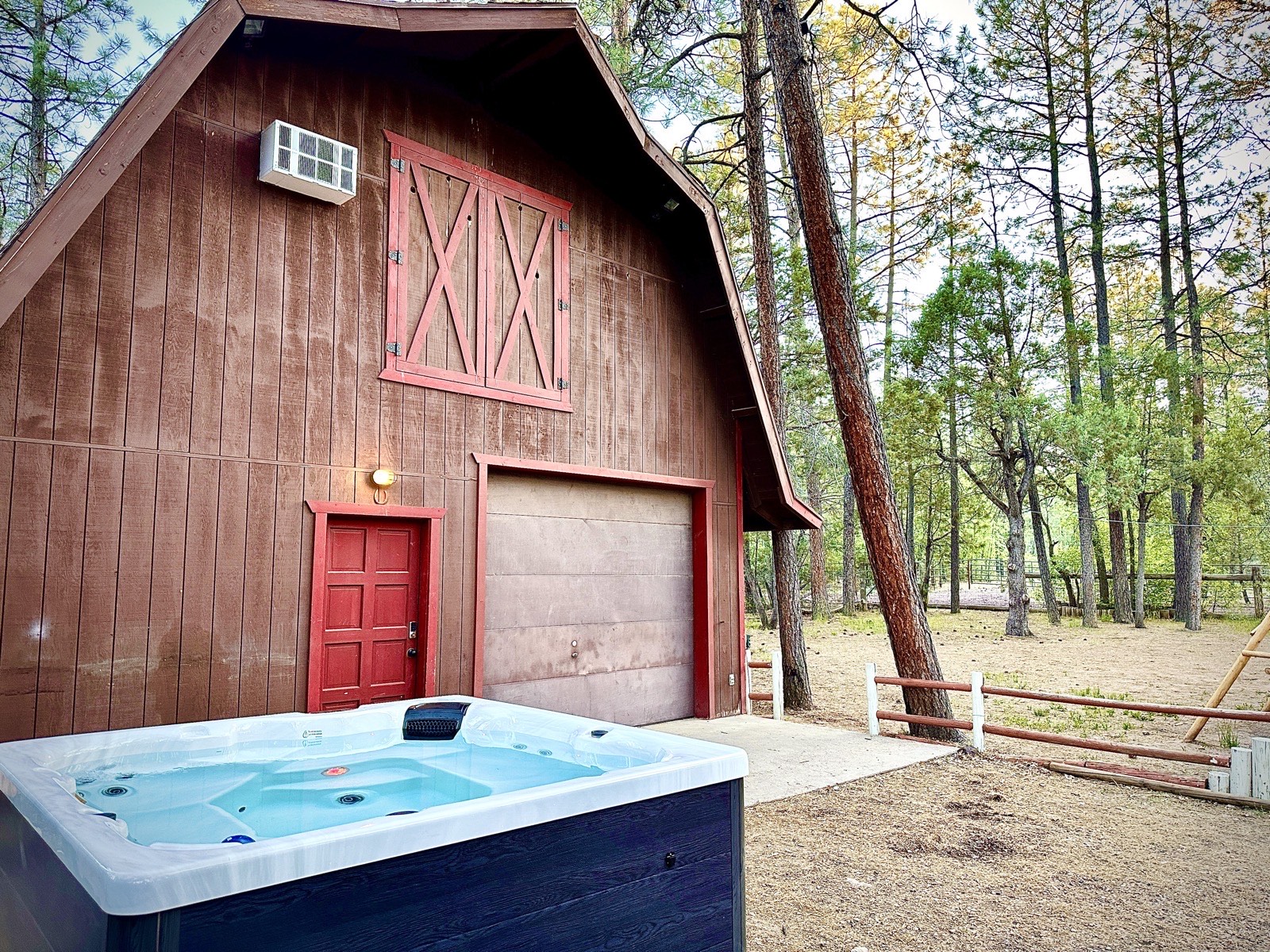 Mohave Cabin barndominium exterior with hot tub