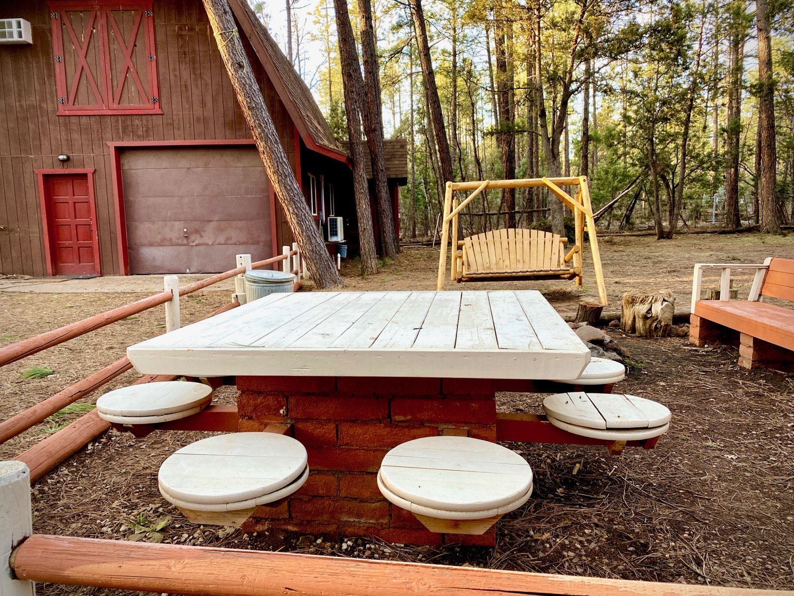 Mohave Cabin barndominium with outdoor bench platform