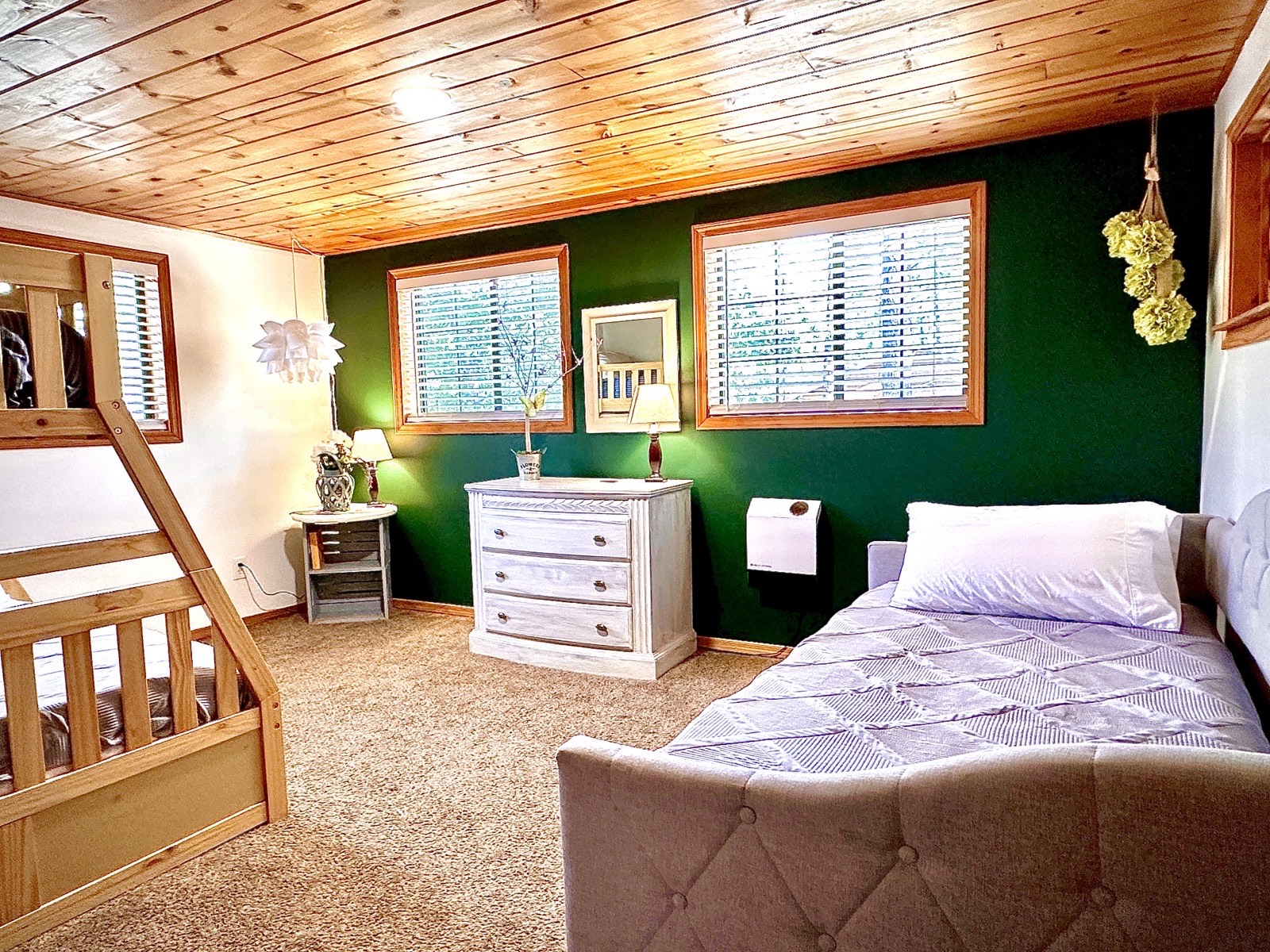Mohave Cabin bedroom with green accent wall