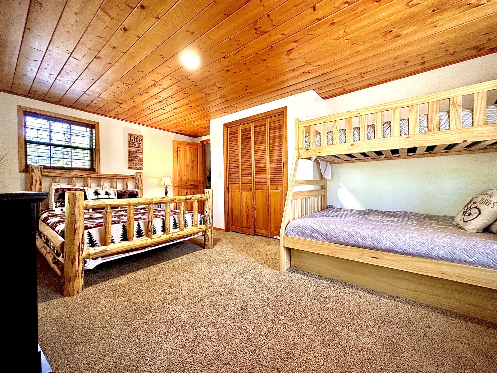 Mohave Cabin bunk room with wood paneling