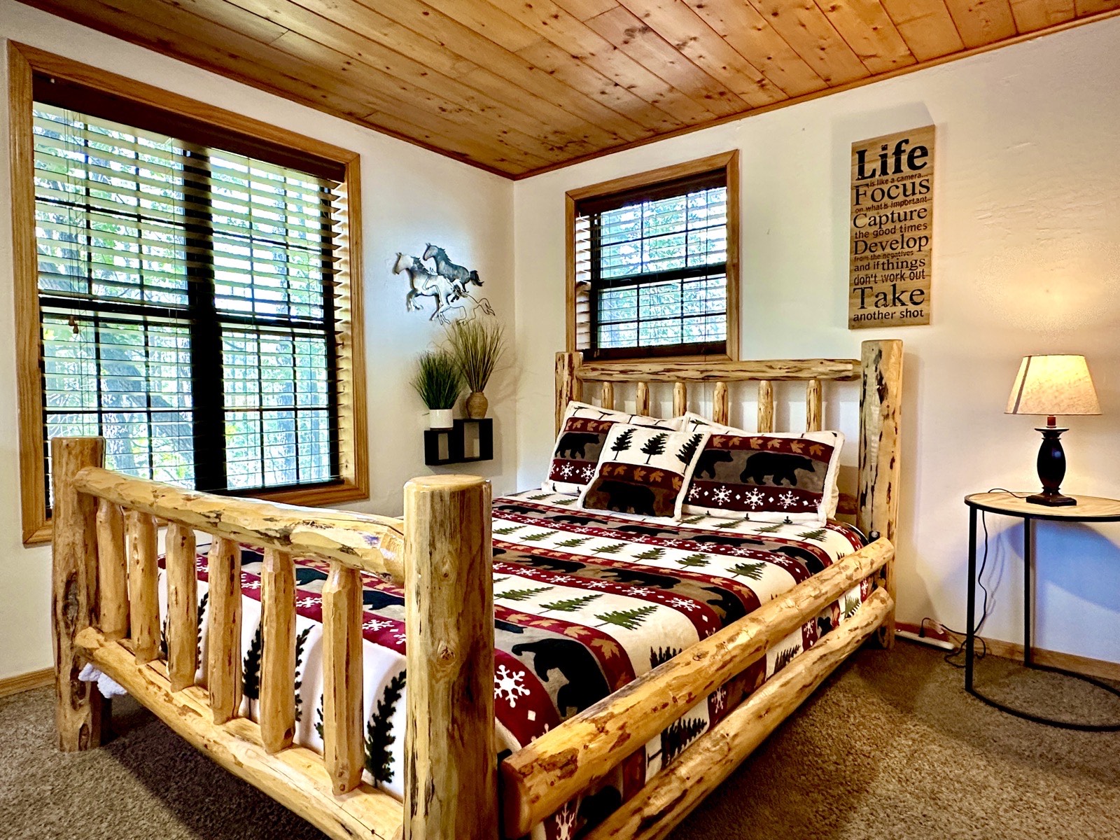 Mohave Cabin bedroom with log bed frame