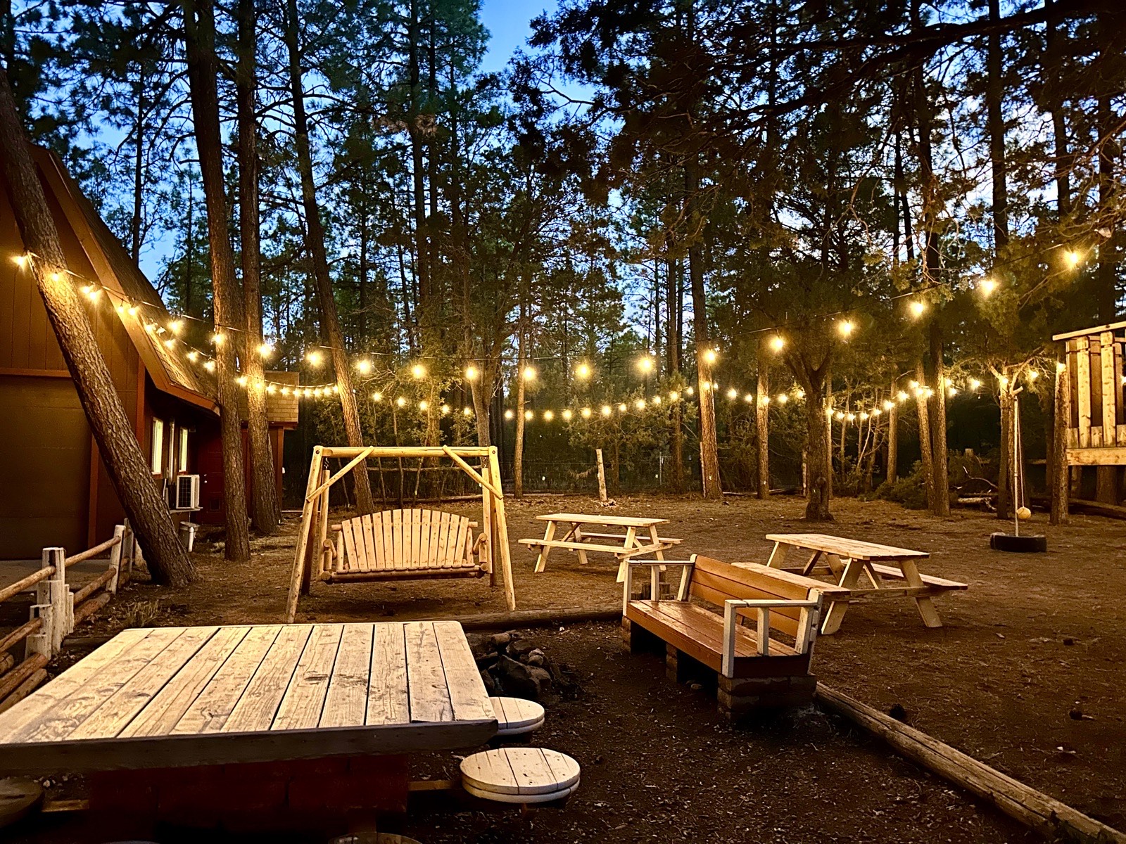 String lights over the deck at Mohave Cabin in the evening
