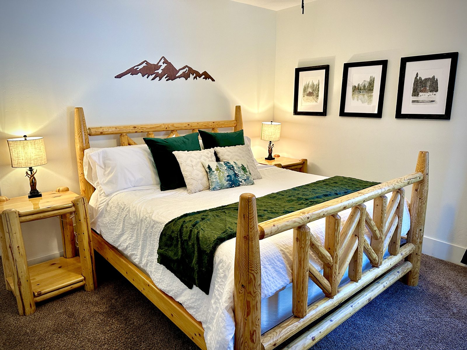 Parkway Lodge king bedroom with log bed and mountain art