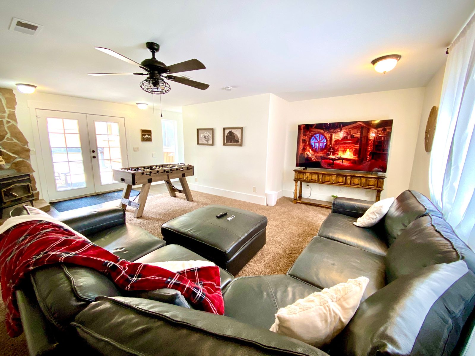 Parkway Lodge game room with foosball table and TV