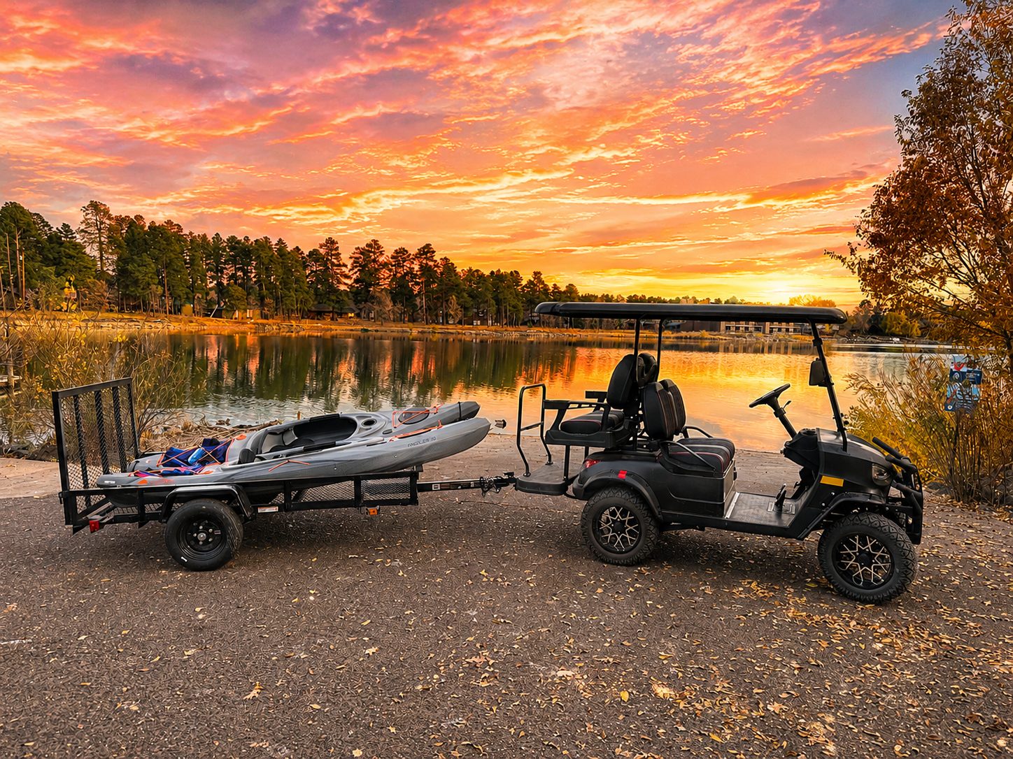 Golf cart and kayak at a Rainbow Lake sunset near Parkway Lodge
