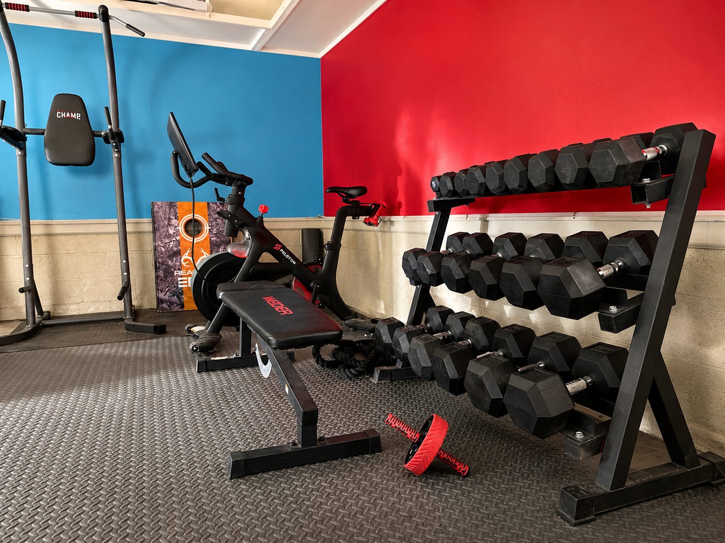 Parkway Lodge home gym with Peloton bike and dumbbells